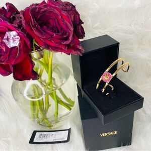 Versace Gold Bracelet with Medussa Surrounded by Pink Stones. Expandable
